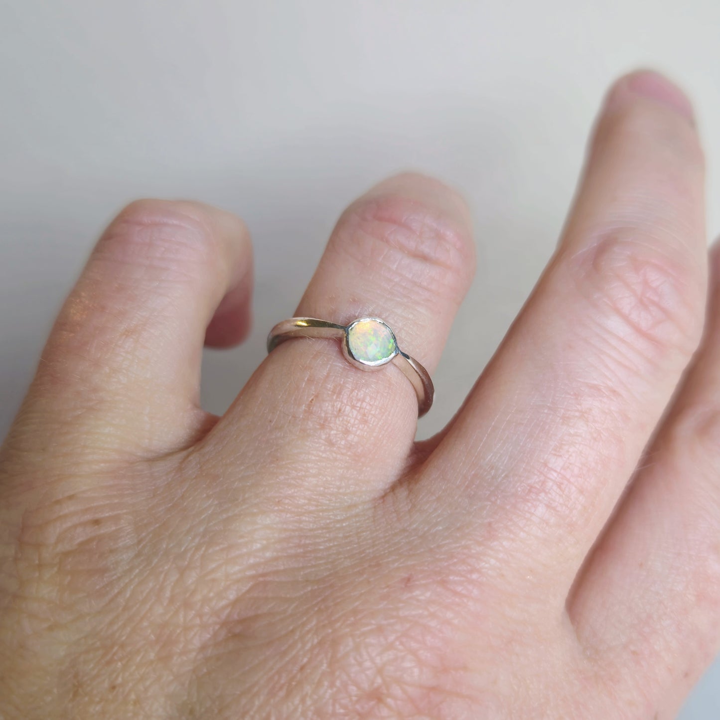 Tapered band with Ethiopian opal